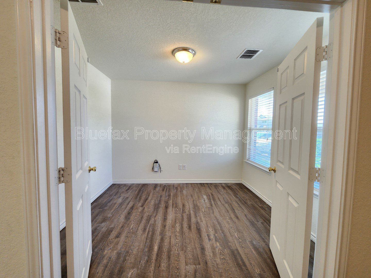 HUGE Covered Patio with Built In Counters, a Refrigerator and a Place for Your Grill! property image