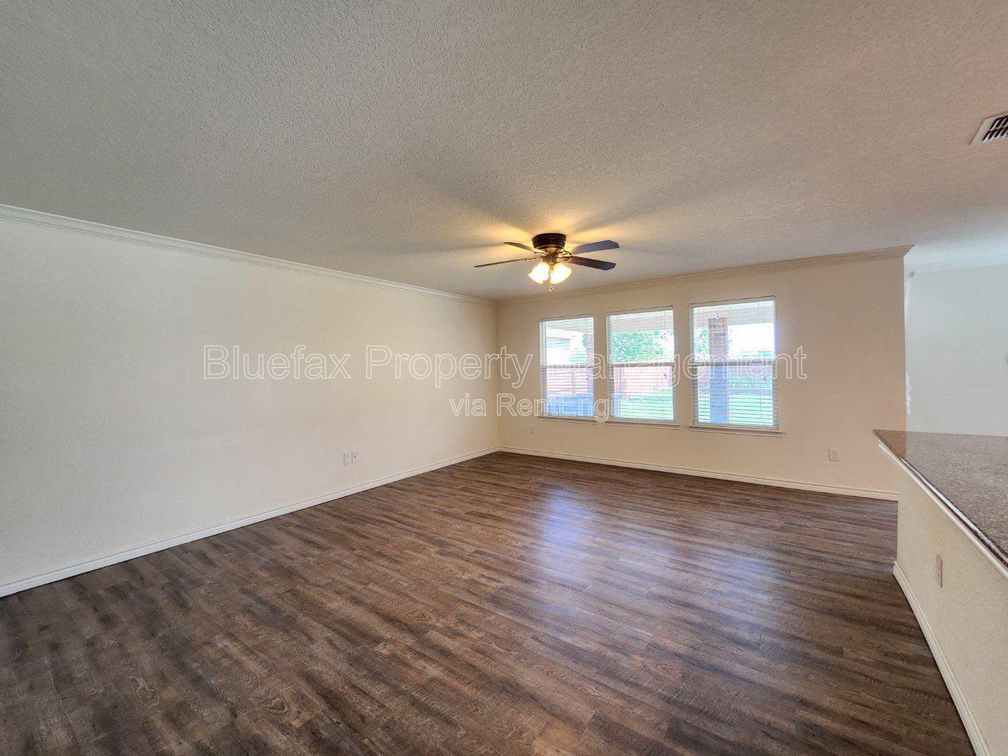 HUGE Covered Patio with Built In Counters, a Refrigerator and a Place for Your Grill! property image