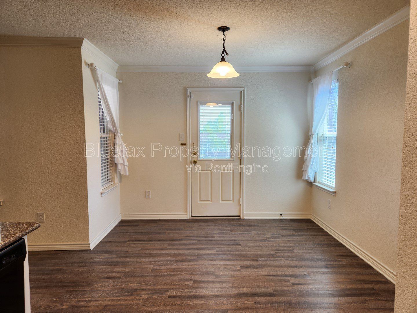HUGE Covered Patio with Built In Counters, a Refrigerator and a Place for Your Grill! property image