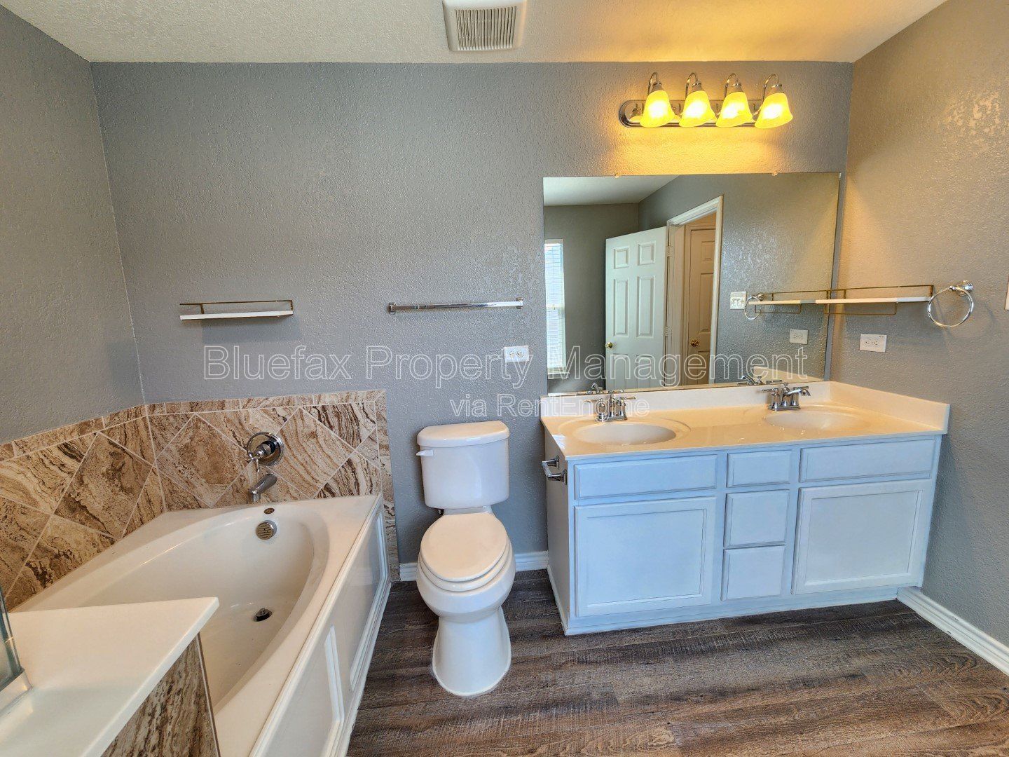 HUGE Covered Patio with Built In Counters, a Refrigerator and a Place for Your Grill! property image