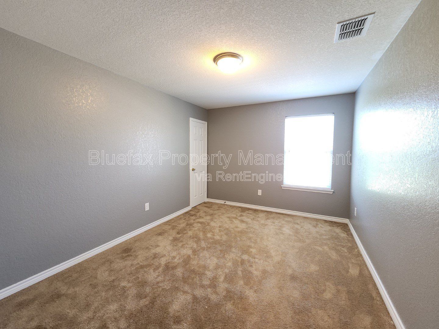 HUGE Covered Patio with Built In Counters, a Refrigerator and a Place for Your Grill! property image