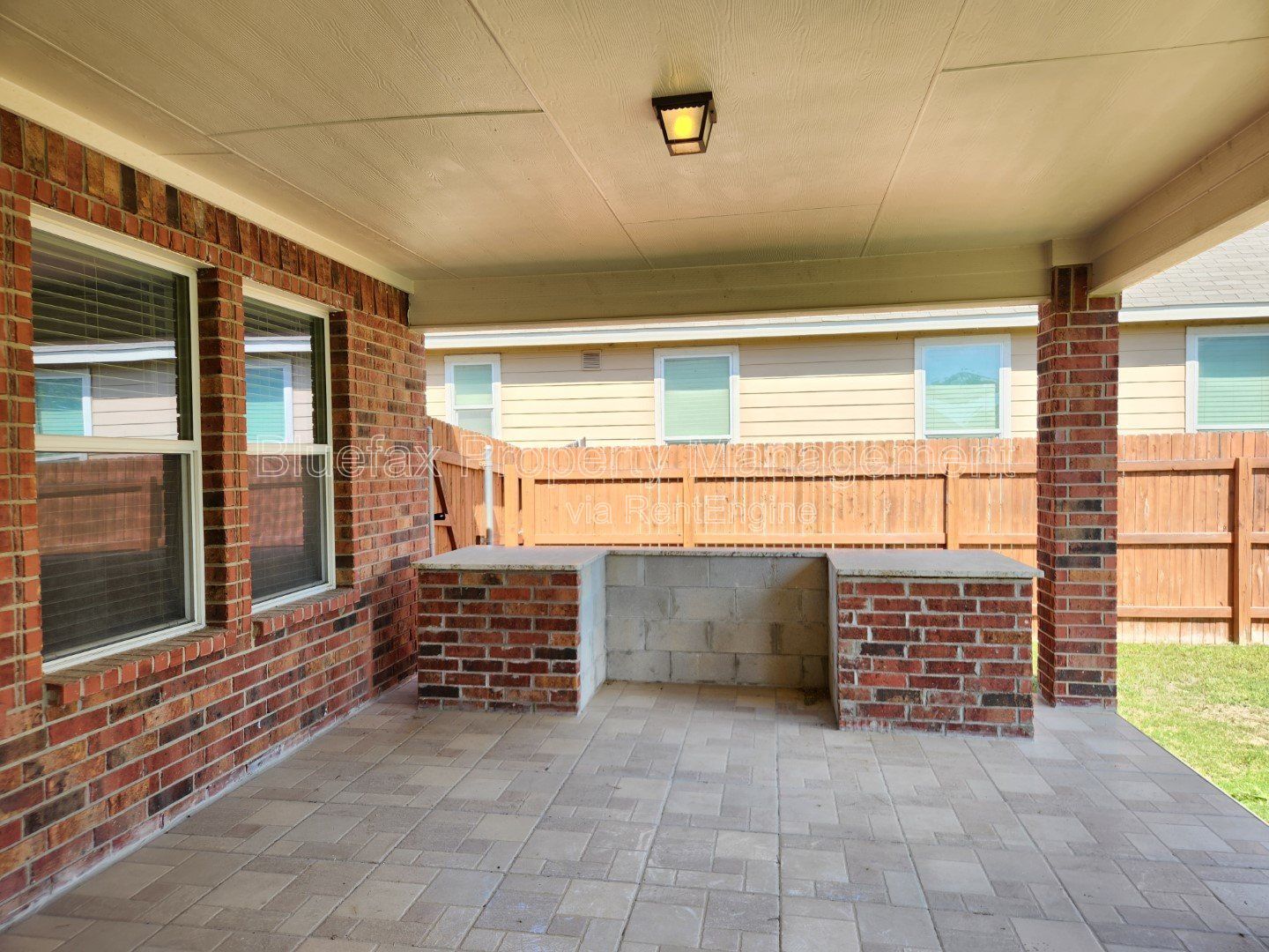 HUGE Covered Patio with Built In Counters, a Refrigerator and a Place for Your Grill! property image