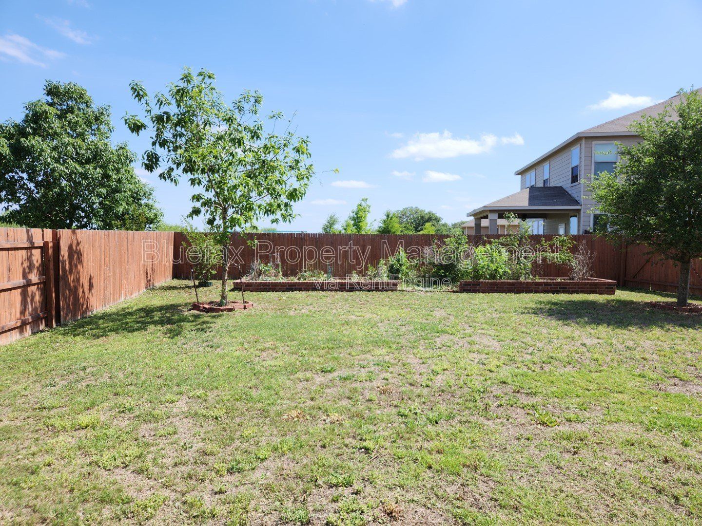 HUGE Covered Patio with Built In Counters, a Refrigerator and a Place for Your Grill! property image