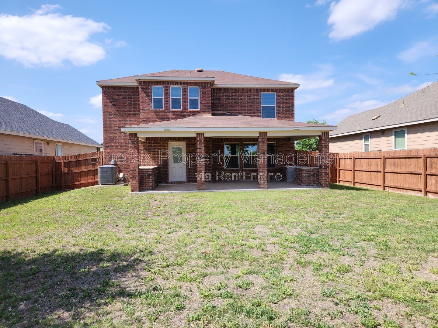 HUGE Covered Patio with Built In Counters, a Refrigerator and a Place for Your Grill! property image
