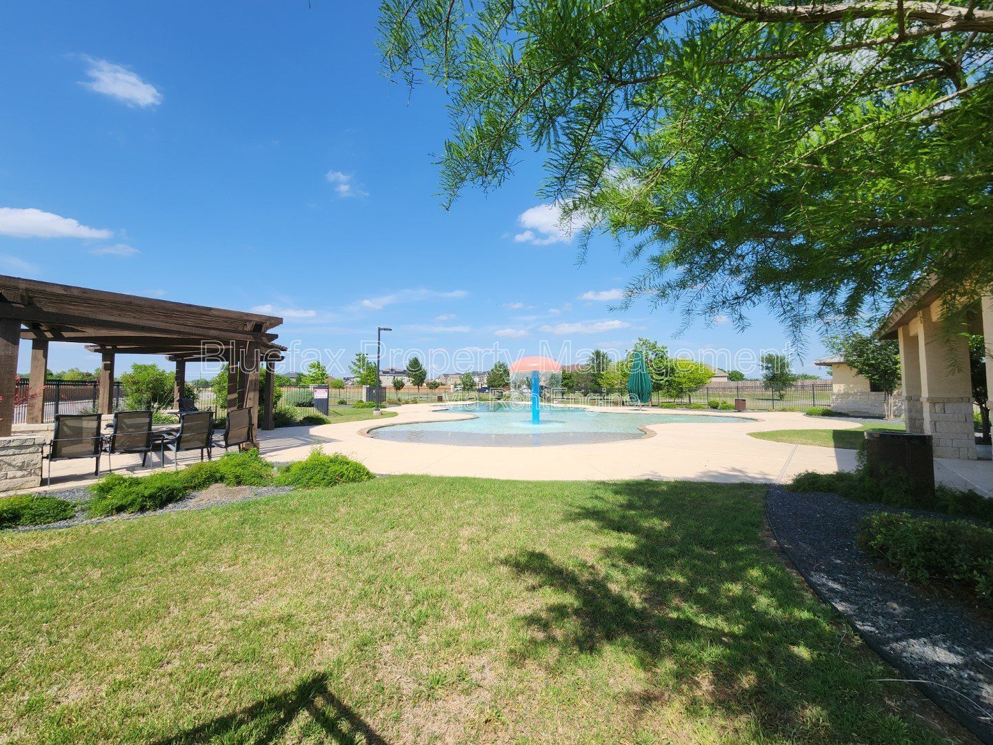 HUGE Covered Patio with Built In Counters, a Refrigerator and a Place for Your Grill! property image