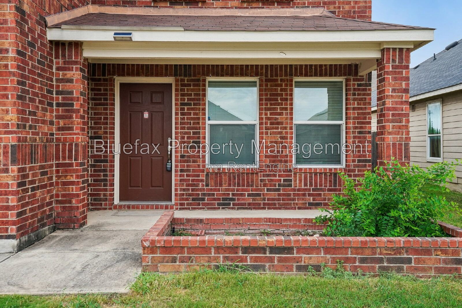 HUGE Covered Patio with Built In Counters, a Refrigerator and a Place for Your Grill! property image