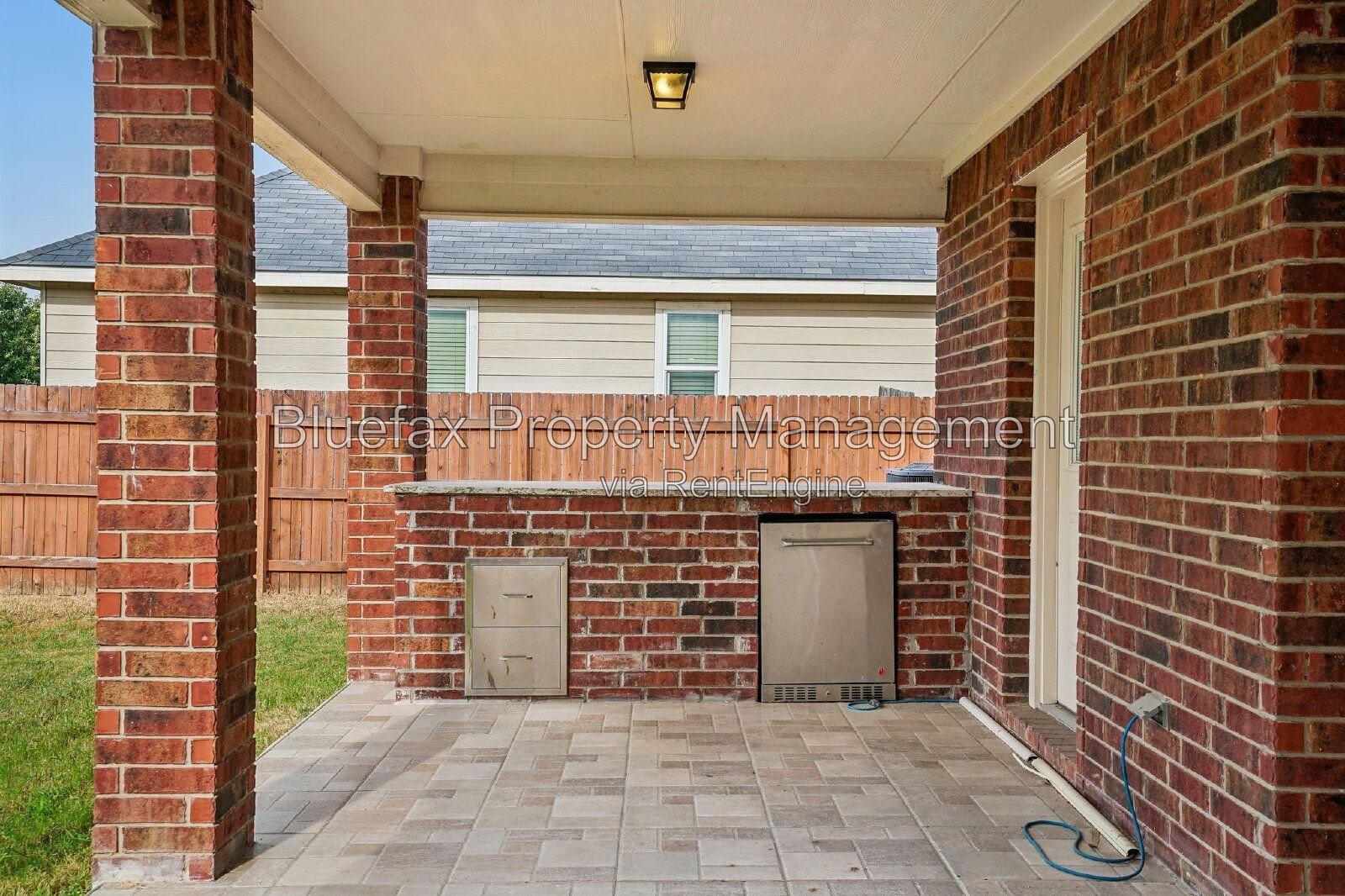 HUGE Covered Patio with Built In Counters, a Refrigerator and a Place for Your Grill! property image
