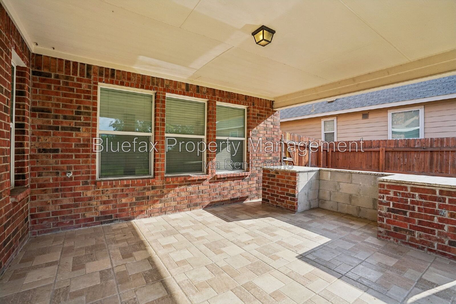 HUGE Covered Patio with Built In Counters, a Refrigerator and a Place for Your Grill! property image