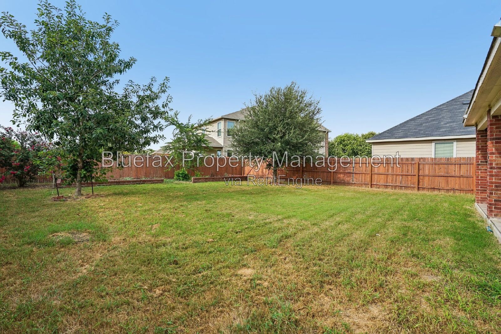 HUGE Covered Patio with Built In Counters, a Refrigerator and a Place for Your Grill! property image