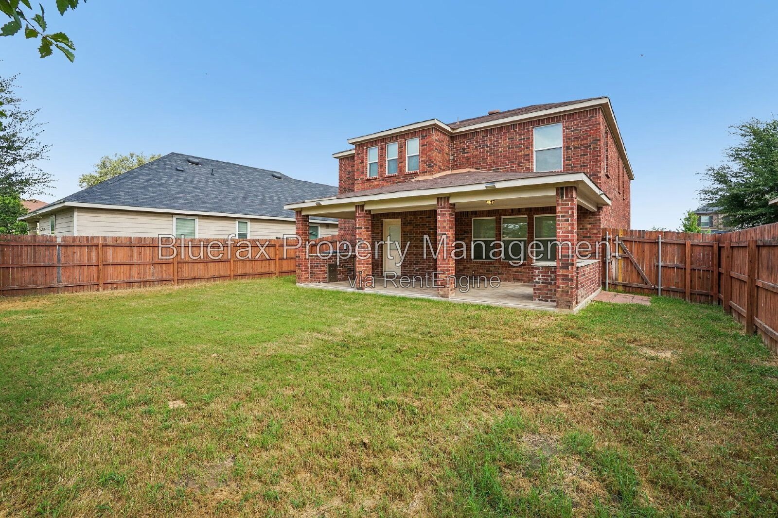 HUGE Covered Patio with Built In Counters, a Refrigerator and a Place for Your Grill! property image